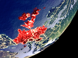 Western Europe from space on model of Earth at night. Very fine detail of the plastic planet surface and visible bright city lights.