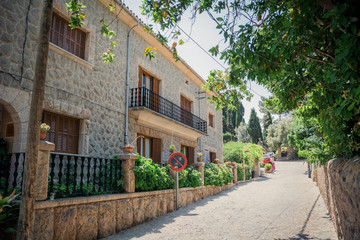 Valldemossa, Mallorca, Balearic Islands, Spain - July 21, 2013: View of the narrow streets of Valldemossa