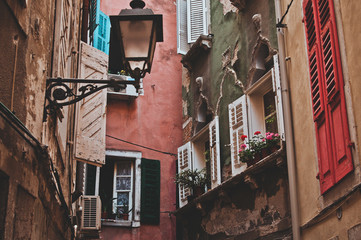 Beautiful colored old houses with stylish windows in the city of Piran. Architecture in the...