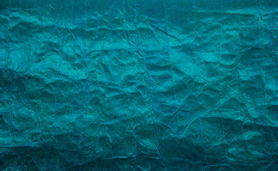 Turquoise paper background. Crumpled paper background. Crumpled paper texture. Copy space