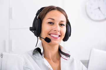 woman with headset in call center .