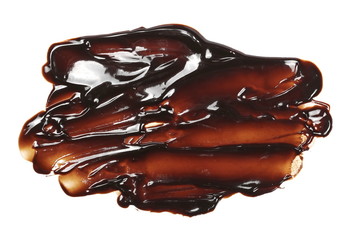 Melted chocolate for topping isolated on white background, top view