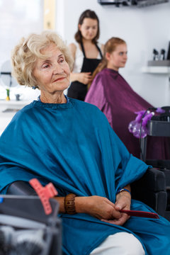 Elderly female client waiting for hair styling