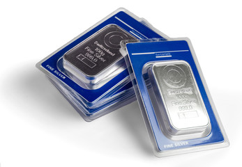 Five minted silver bars in blister pack. On a white background.