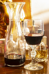 red wineglass with wine pitcher