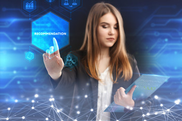 The concept of business, technology, the Internet and the network. A young entrepreneur working on a virtual screen of the future and sees the inscription: Recommendation