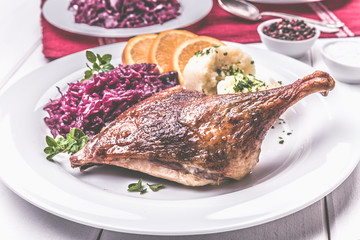 Duck with dumplings and red cabbage