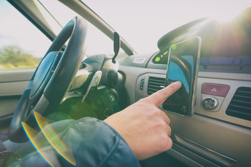 Woman using smort phone while driving the car