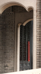 Chinese style hallway with red window and traditional black door, China, Asia
