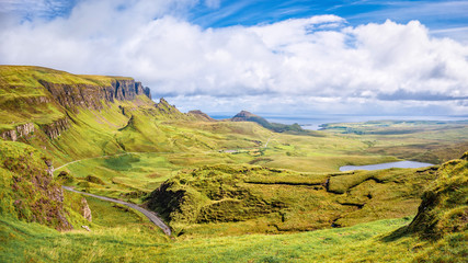 Panoramic aerial view of Quiraing and Staffin Bay on Isle of Skye, Scotland. Copy space in blue sky.