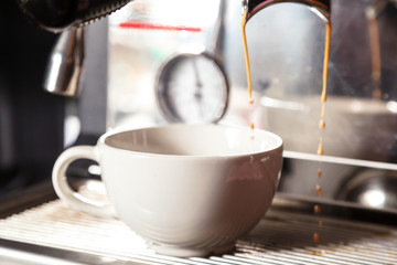 Barista preparing cappuccino with coffee machine. Coffee Preparation Concept.