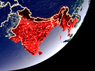 BIMSTEC memeber states from space on model of Earth at night. Very fine detail of the plastic planet surface and visible bright city lights.