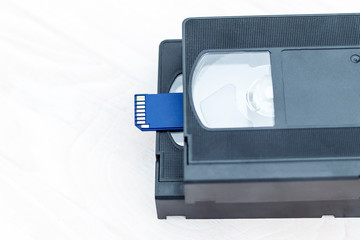 The video is big and small. Memory card to record video. The concept of perfect video storage technology. on a white background. no isolation. there is toning.