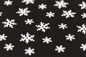 White snowflakes isolated on black background closeup