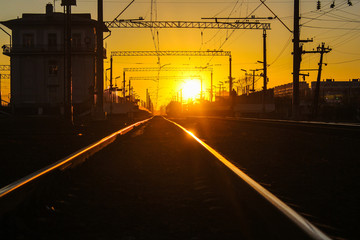 Fototapeta na wymiar railway at sunset public transport. transportation of people and freight.