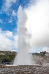 Fototapeta na wymiar Geysir Strokkur in Iceland erupts with tall fountain