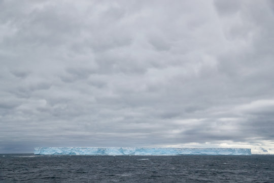 Tabular iceberg floating in sea