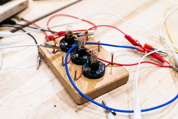 electric circuits in low voltage children, mounted on wooden bases with copper nails for alligator...