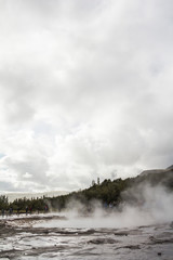 Steam on Geysir Strokkur before eruption in Iceland