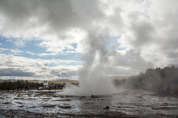 Geysir Strokkur in Iceland erupts on cloudy day