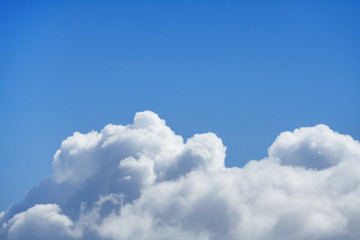 Naklejka na ściany i meble White clouds in bright azure sky with copy space (background)