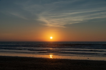 No people with a golden sunset over the Atlantic Ocean from Agadir Beach, Morocco, Africa