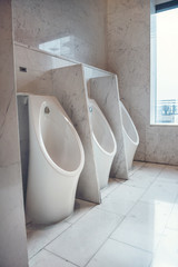 row of Urinal in the bathroom toilet for men