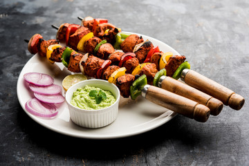 Indian chicken tikka kebabs, marinated in spices and yogurt and roasted in tandoor. served with...