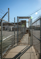 Security fence at historic New Bedford Gas and Edison Light Complex