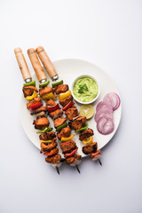 Indian chicken tikka kebabs, marinated in spices and yogurt and roasted in tandoor. served with...