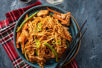 Asian noodles with pork in teriyaki sauce, with green beans, carrots and shiitake mushrooms.
