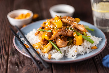 Kung Pao chicken, stir-fried Chinese sichuan traditional sichuan  dish with chicken, peanuts, vegetables and chili peppers.