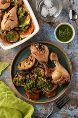 Ratatouille with chicken and pesto. French cuisine. Rosemary chicken with oven-roasted ratatouille.