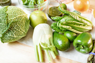 Green raw vegetables on the kitchen table