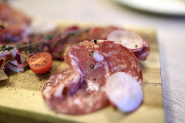 Sausage coppa on wooden plate
