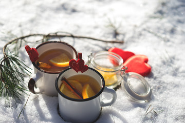 Nice warm cup of tea or coffee outdoors in the snowy scene