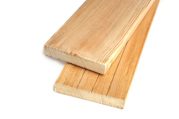 Two larch wood plank boards isolated on white background. Wood planks close up view.