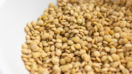 Close of lentils on white background