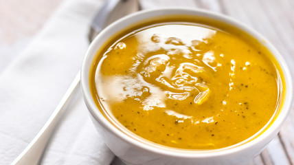 Close of white bowl with cabotia pumpkin soup