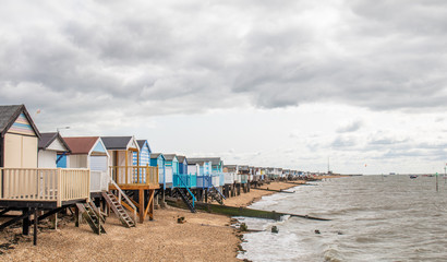 UK beach huts on the sea shore