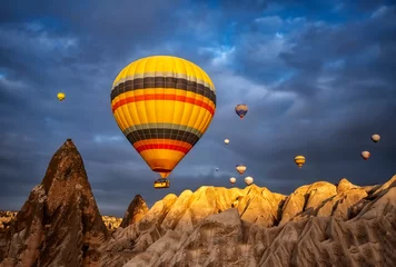 Foto op Canvas Hot air balloon flying over spectacular Cappadocia © blackdiamond67