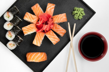 close up of sashimi sushi set with chopsticks and soy on a serving tray