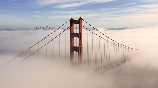San Francisco Golden Gate Bridge Sticking/Poking Through Thick Fog - Aerial View / Flyover From Helicopter
