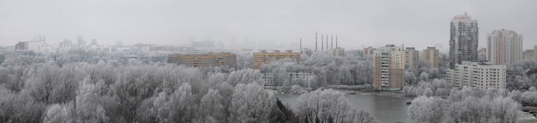 Panoramic view of a winter cityscape with white trees covered in frost. View from high above, Minsk, Belarus