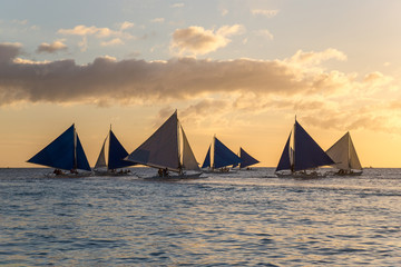 Small sailing boats at the sunset. Boracay, Philippines
