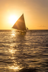 Small sailing boats at the sunset. Boracay, Philippines