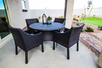 Outdoor Wicker Table And Chairs On Patio