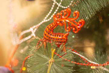 background,Christmas toy on a background of green spruce
