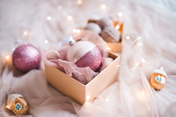 Fototapeta na wymiar Christmas decorations in open present box closeup. Winter holidays.