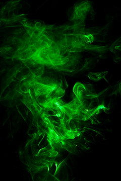 Green smoke on black background